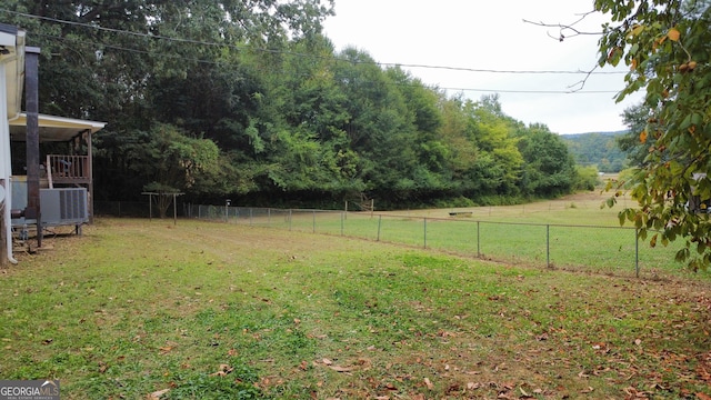 view of yard with central AC