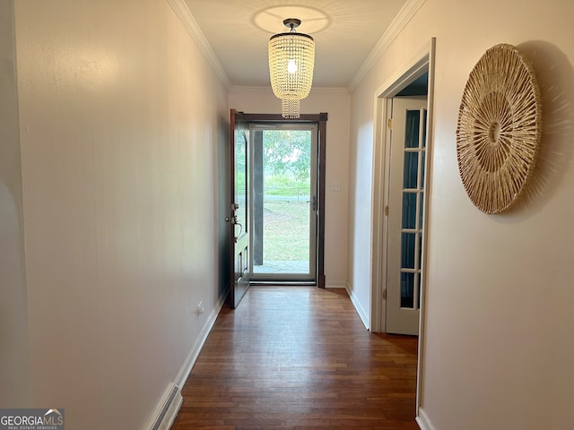 doorway to outside with crown molding, a notable chandelier, and dark hardwood / wood-style floors