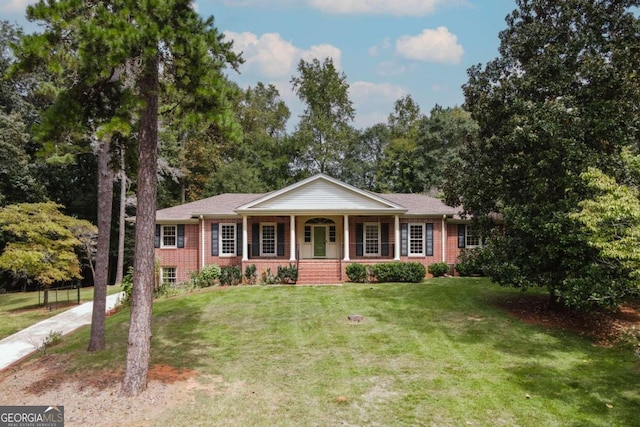 ranch-style house featuring a front yard and a porch