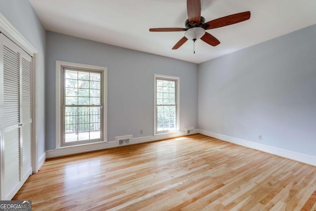 empty room featuring ceiling fan and light hardwood / wood-style flooring