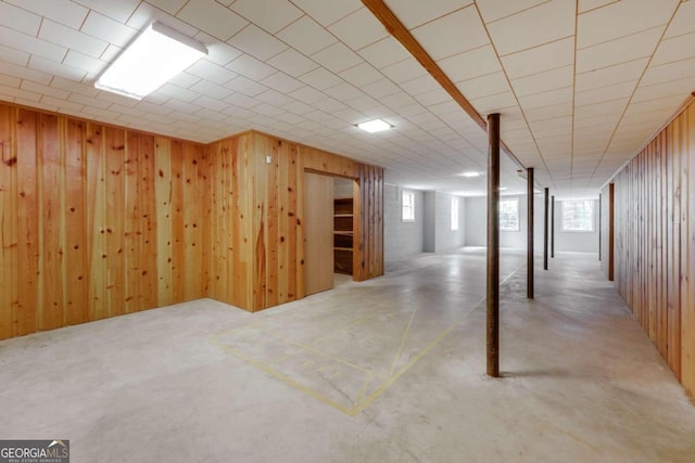 basement with wood walls