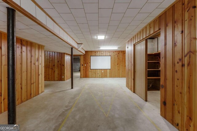 basement with wooden walls