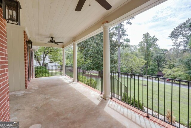 view of patio with a balcony and ceiling fan