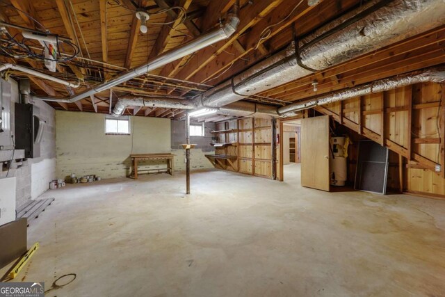 basement featuring gas water heater