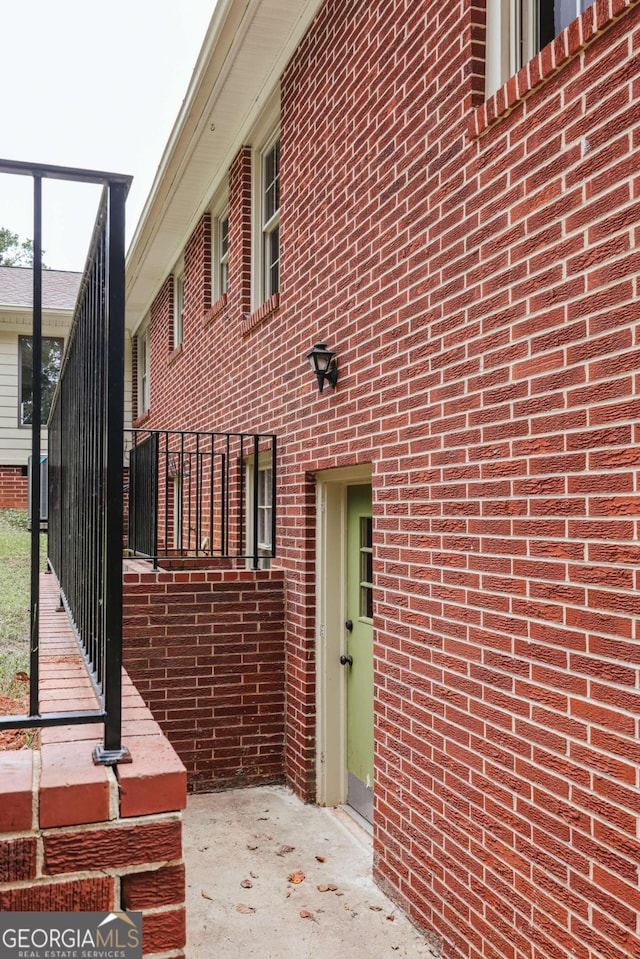 view of property exterior featuring brick siding