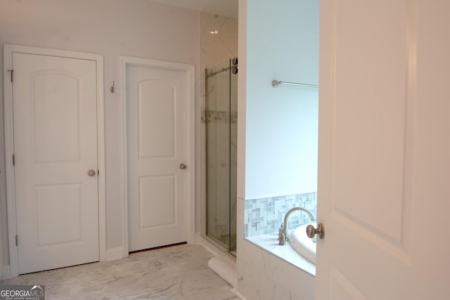 full bathroom featuring a marble finish shower, marble finish floor, and a bath