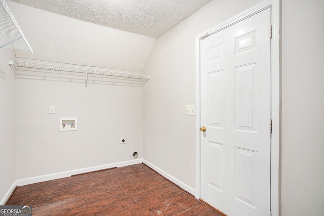 clothes washing area featuring hookup for a washing machine, dark hardwood / wood-style floors, electric dryer hookup, and a textured ceiling