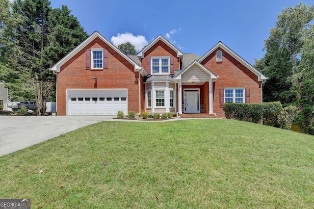 view of front facade with a garage and a front yard