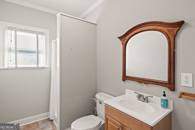 bathroom with ornamental molding, vanity, toilet, and walk in shower