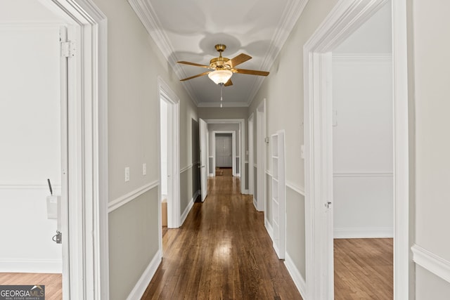 hall featuring crown molding and dark wood-type flooring