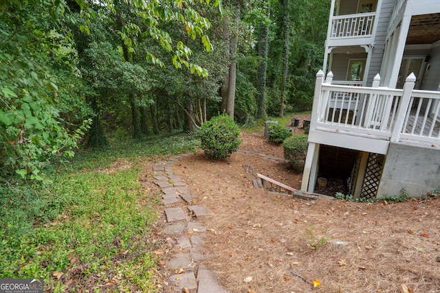 view of yard featuring a wooden deck