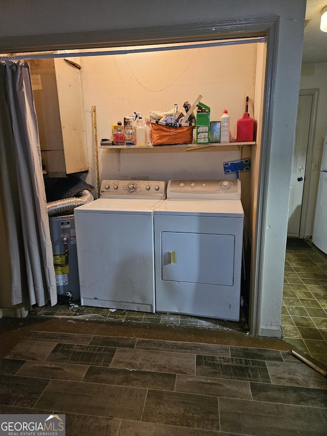 laundry area featuring washing machine and clothes dryer