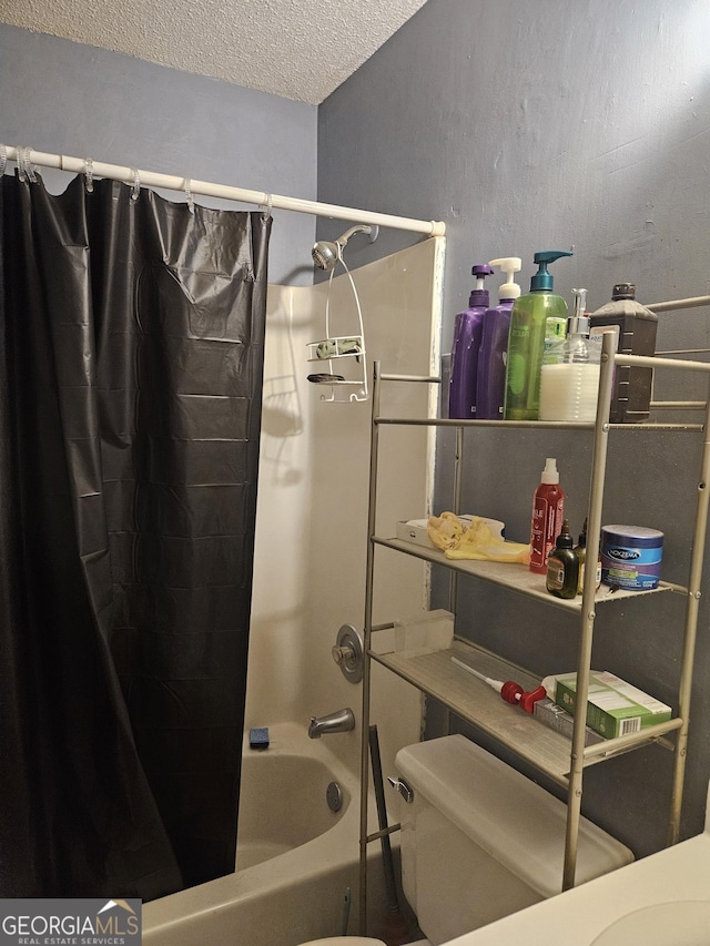 bathroom with a textured ceiling, toilet, and shower / bath combination with curtain