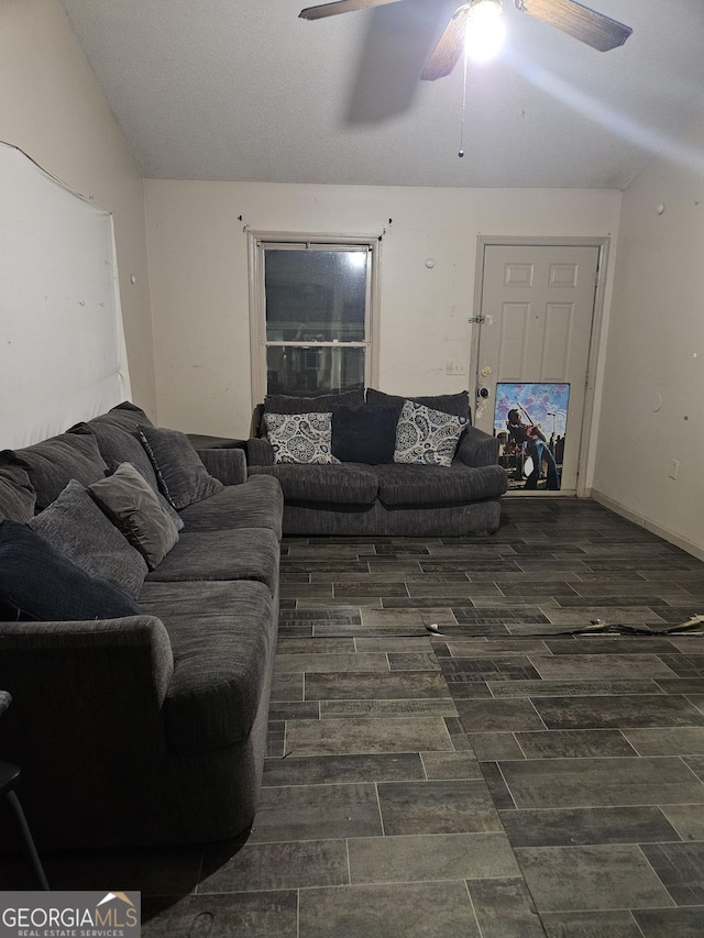 living room featuring vaulted ceiling and ceiling fan