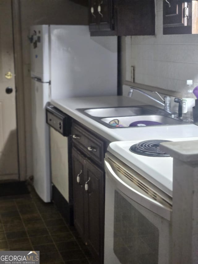 kitchen featuring dark brown cabinetry, dishwasher, tasteful backsplash, electric stove, and sink