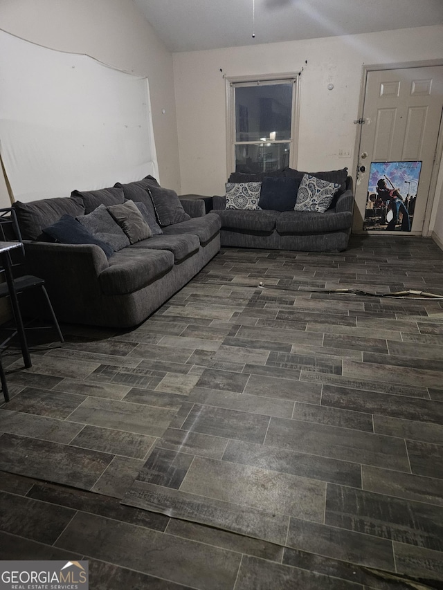 living room featuring vaulted ceiling