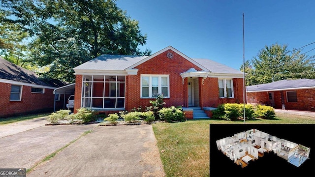 bungalow-style home featuring a front yard and a sunroom