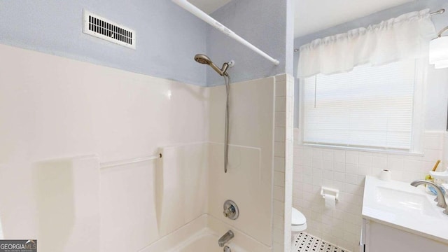 full bathroom with shower / bathing tub combination, vanity, and toilet