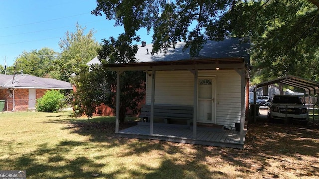 view of outbuilding featuring a lawn and a carport