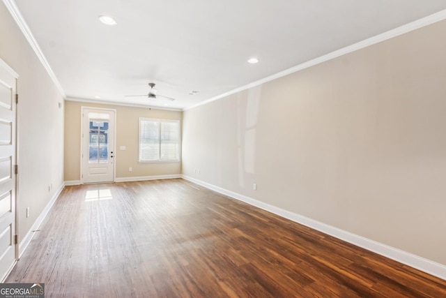 spare room featuring baseboards, ceiling fan, ornamental molding, wood finished floors, and recessed lighting