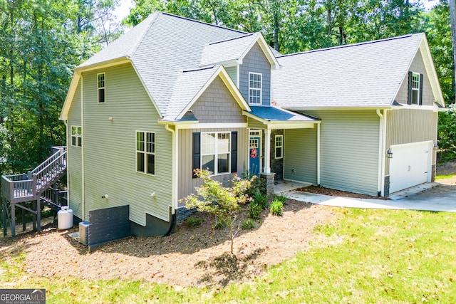 view of front of home featuring a garage and a front lawn