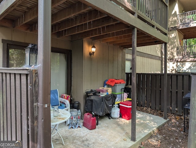 view of patio featuring a balcony