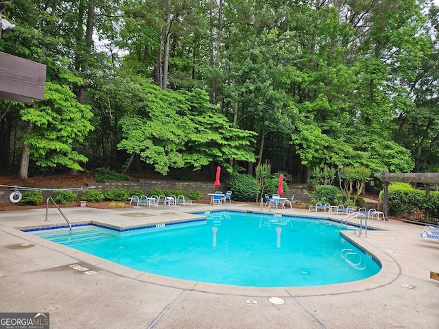 view of pool featuring a patio