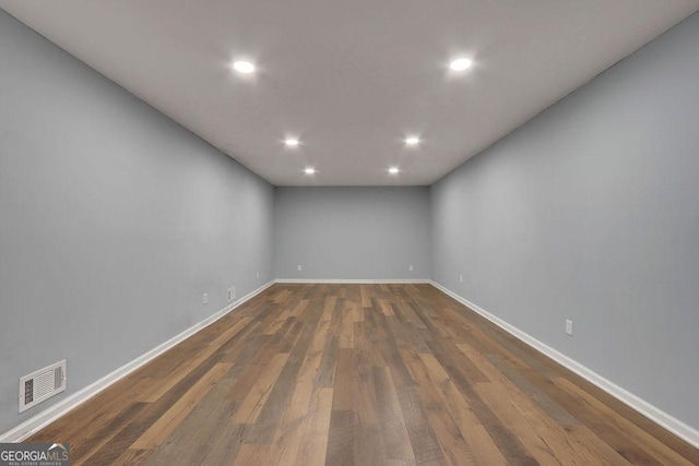 unfurnished room featuring dark hardwood / wood-style floors