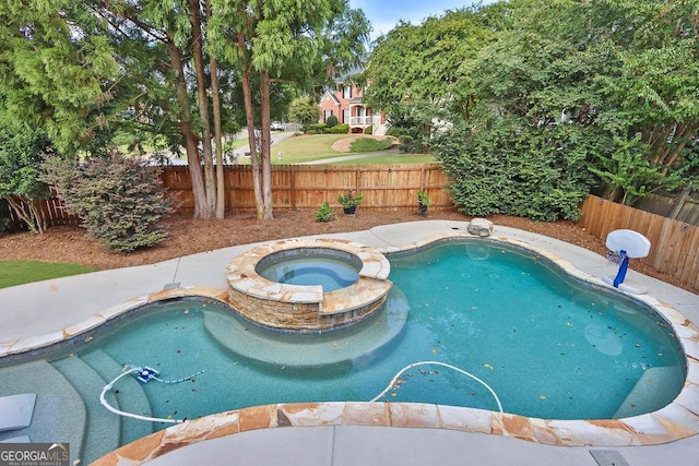 view of swimming pool featuring an in ground hot tub