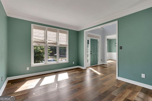 unfurnished room with dark hardwood / wood-style floors and ornamental molding