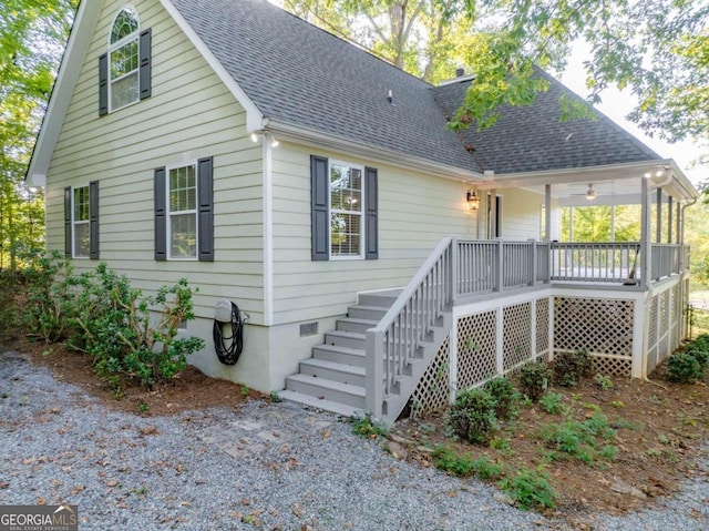 rear view of house featuring a deck