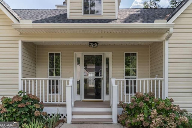 property entrance with covered porch