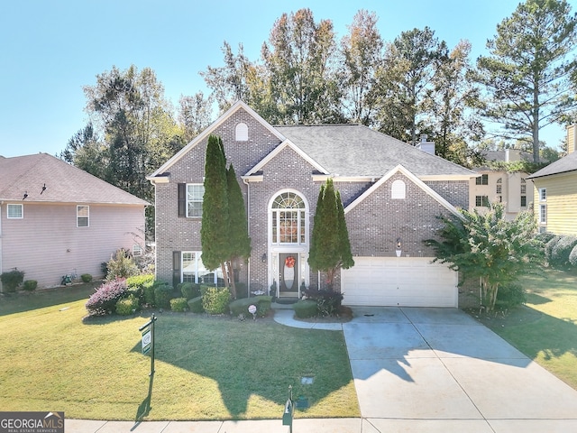 view of front property featuring a front yard and a garage