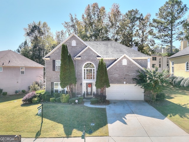 front of property with a front lawn and a garage