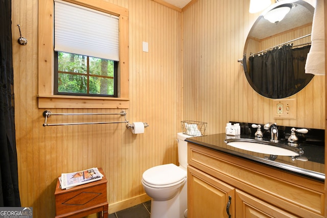 bathroom with a shower with curtain, toilet, tile patterned flooring, and vanity