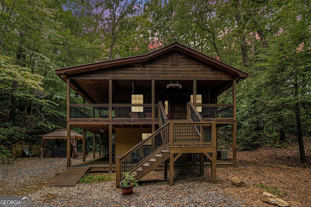 back of house featuring a deck