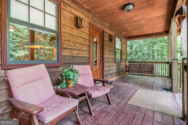 wooden deck featuring covered porch