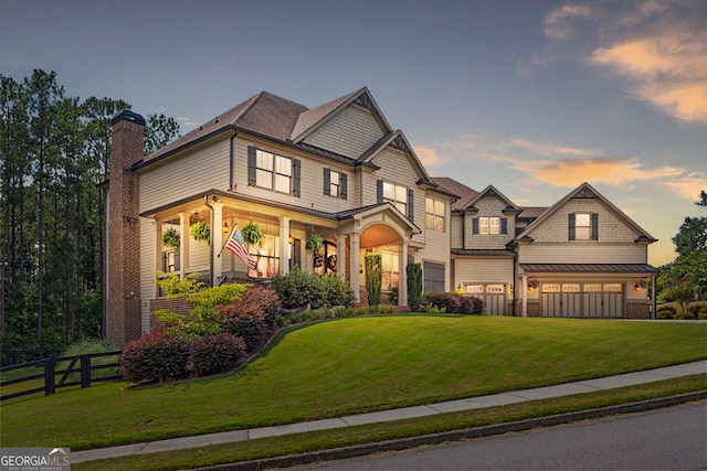 craftsman-style home featuring a lawn