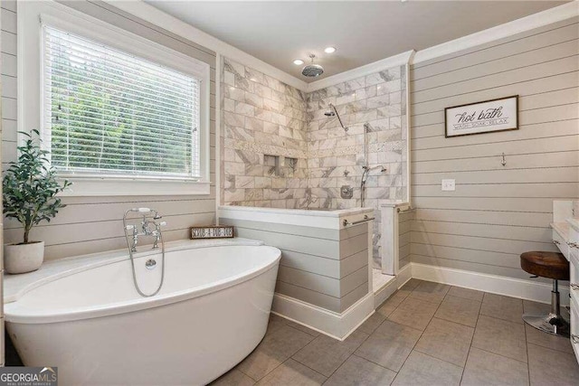 bathroom featuring wooden walls, tile patterned flooring, and independent shower and bath