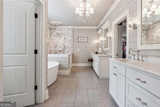 bathroom featuring vanity, crown molding, a notable chandelier, and wood walls