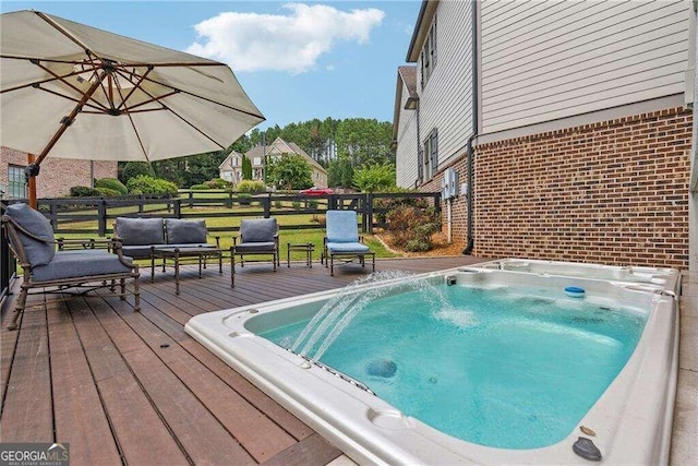 view of pool with a wooden deck