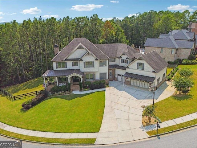 view of front of house with a garage and a front lawn