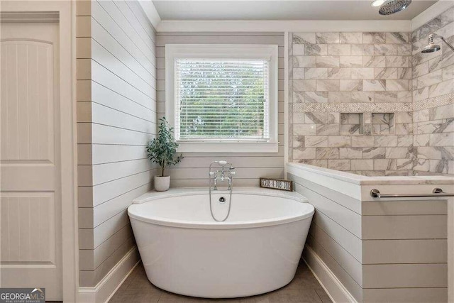 bathroom with tile patterned flooring, shower with separate bathtub, and wood walls