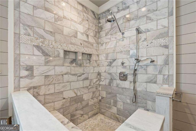 bathroom with tiled shower