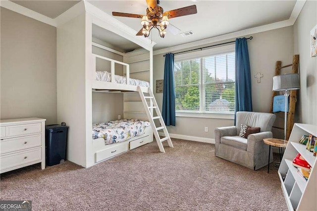 bedroom with carpet floors, ceiling fan, and ornamental molding