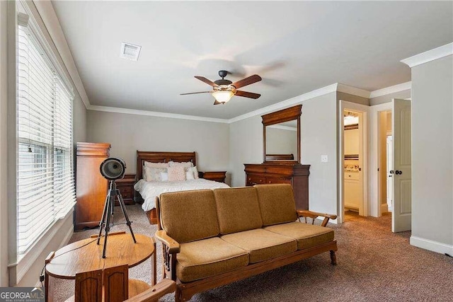 bedroom featuring ceiling fan, crown molding, and carpet floors