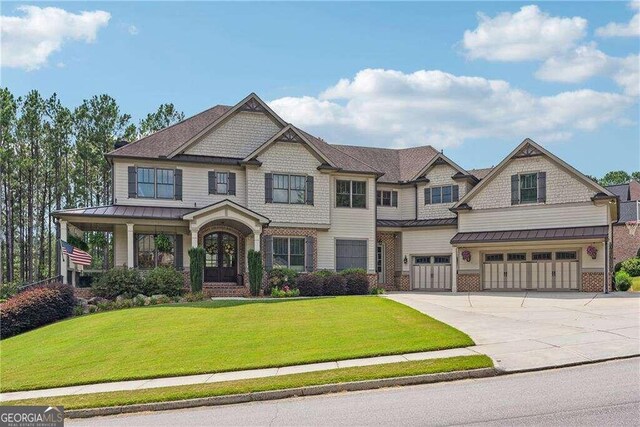 view of front facade with a front yard and a garage