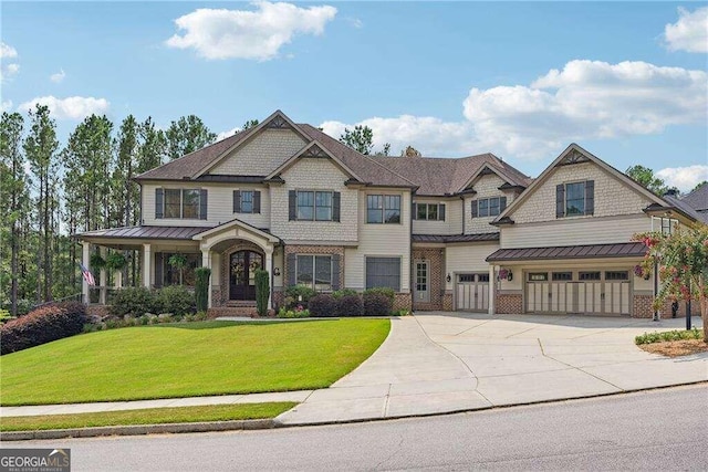 craftsman-style house with a garage and a front lawn