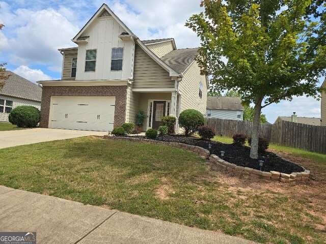 view of front property featuring a front yard and a garage