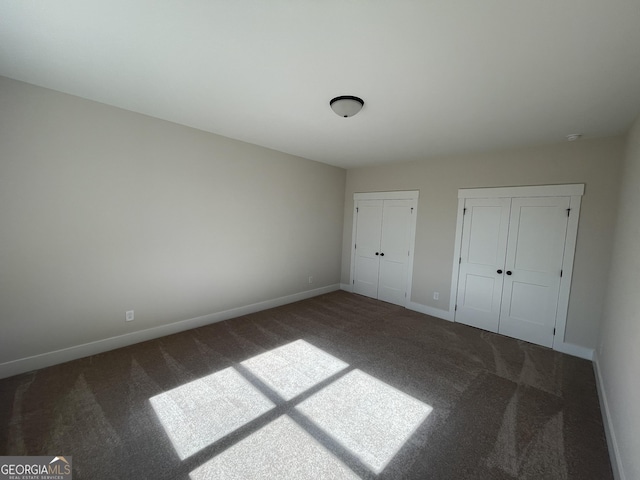 unfurnished bedroom featuring carpet flooring